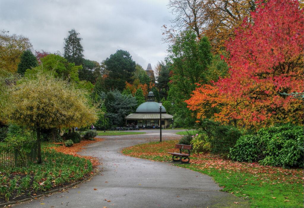 Lawns, flower beds and mature trees in the Valley Gardens at Harrogate