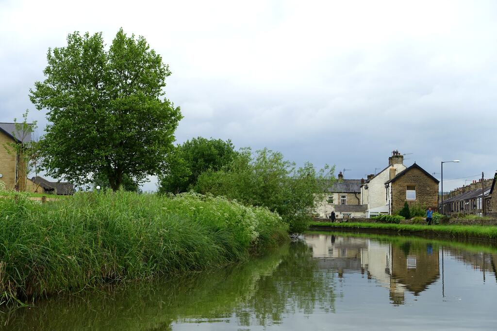Narrowboats moored along the Leeds and Liverpool Canal in the middle of Skipton